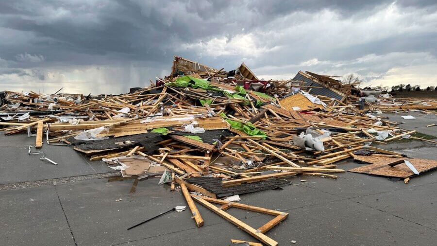 Debris is seen from a destroyed home northwest of Omaha, Nebraska, after a storm tore through the a...
