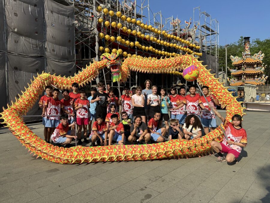 Su Ma Ma Chinese Club poses with traditional dragons...