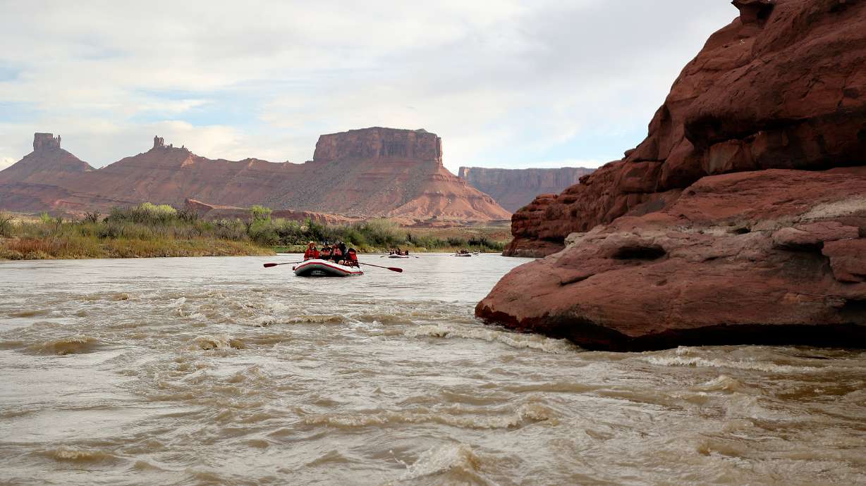 Journalists and water experts raft down the Moab Daily section of the Colorado River with Holiday R...
