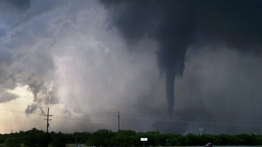 A tornado spins west of Hawley, Texas, as cars pass on U.S. 277 on Thursday May 2, 2024. (Ronald W....