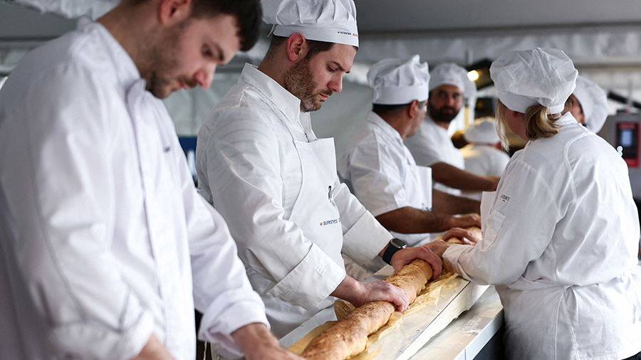 French bakers try not to crack the baguette when it comes out of a large rotating oven....