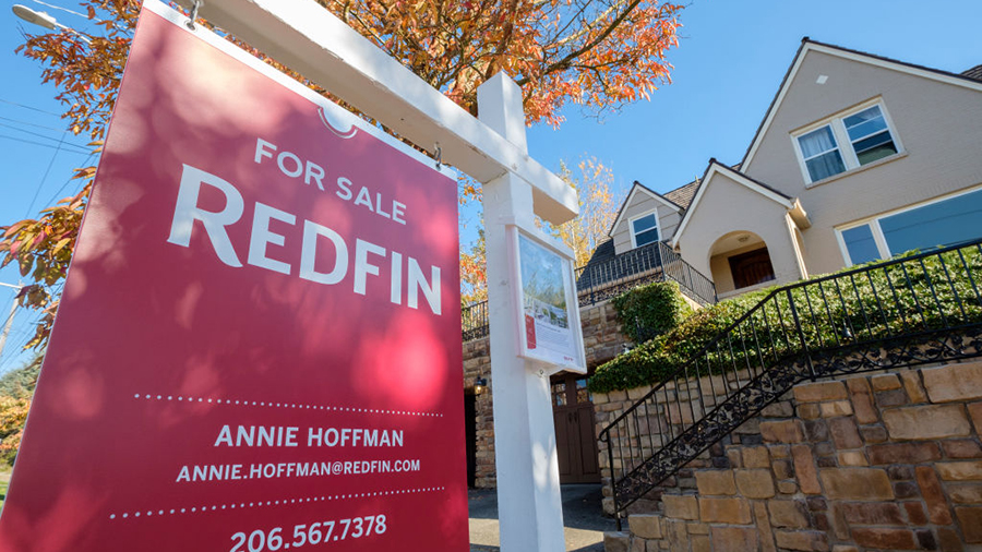 SEATTLE, WA - OCTOBER 31: A Redfin real estate yard sign is pictured in front of a house for sale o...