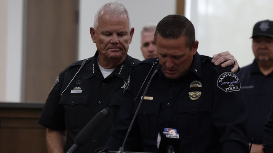 Lt. Mike Wall of Santaquin City Police Department, struggling to speak through tears, after his fel...