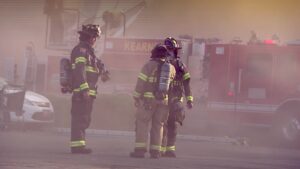 West Valley City firefighters on the parking lot of the strip mall.