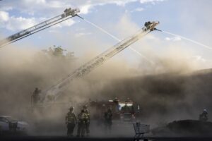 West Valley City firefighters using a fire engine to take down the fire.