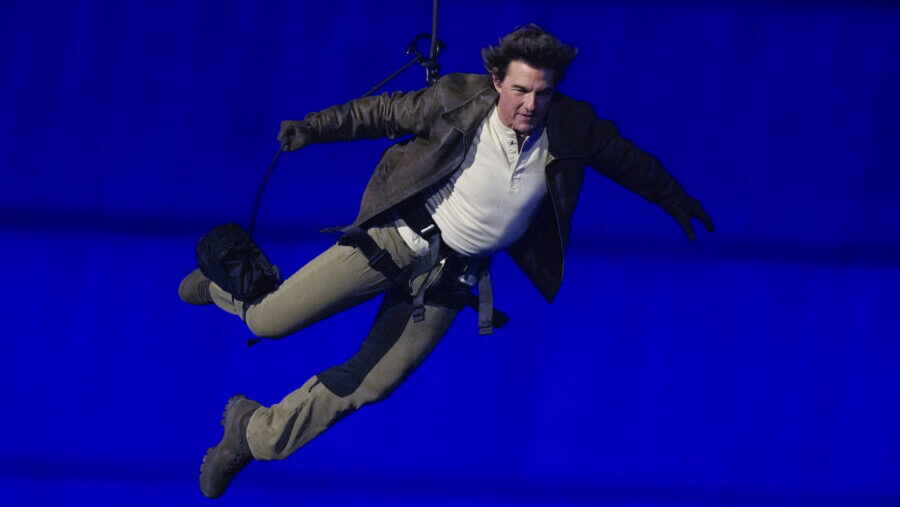 Tom Cruise is lowered on the Stade de France during the 2024 Summer Olympics closing ceremony, Sund...