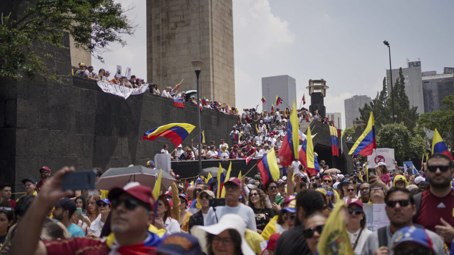 Venezuelan nationals protest against the official results that declared President Nicolas Maduro th...