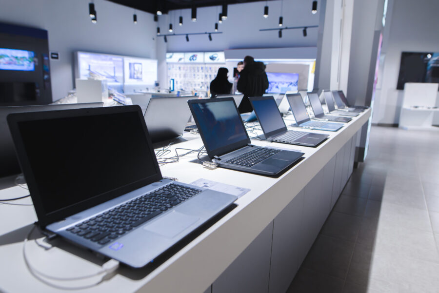 Laptops in a modern technology store. Department of computers in the electronics store. Choosing a ...