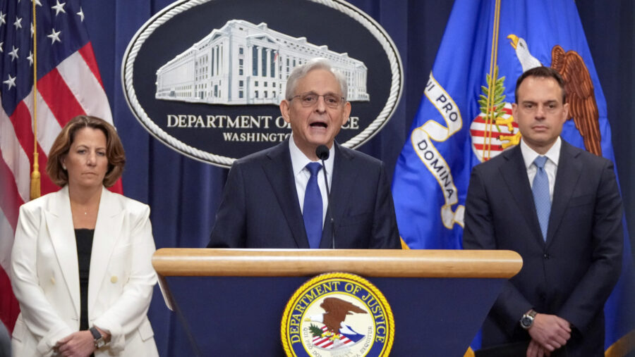 Attorney General Merrick Garland, center, speaks with reporters about an antitrust lawsuit against ...