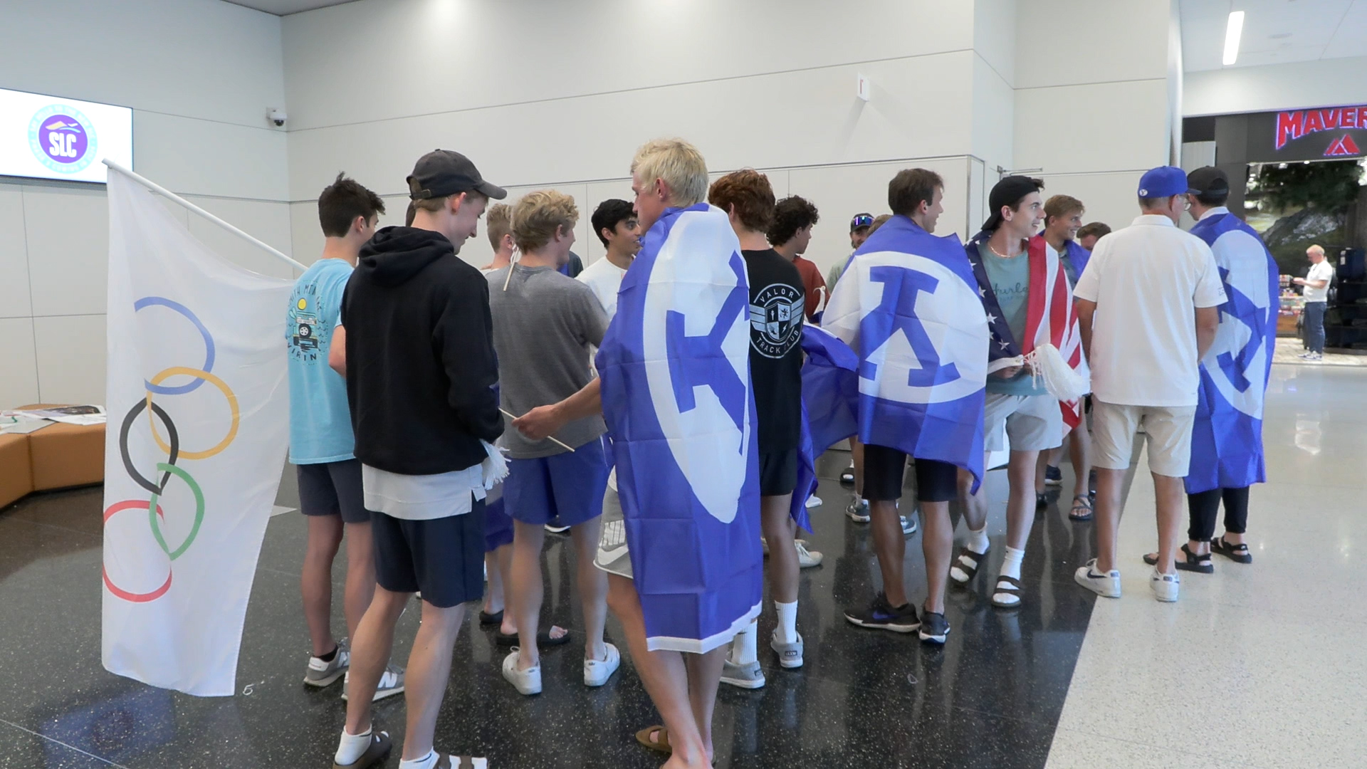 The BYU track and field team waits for Rooks at the airport. 