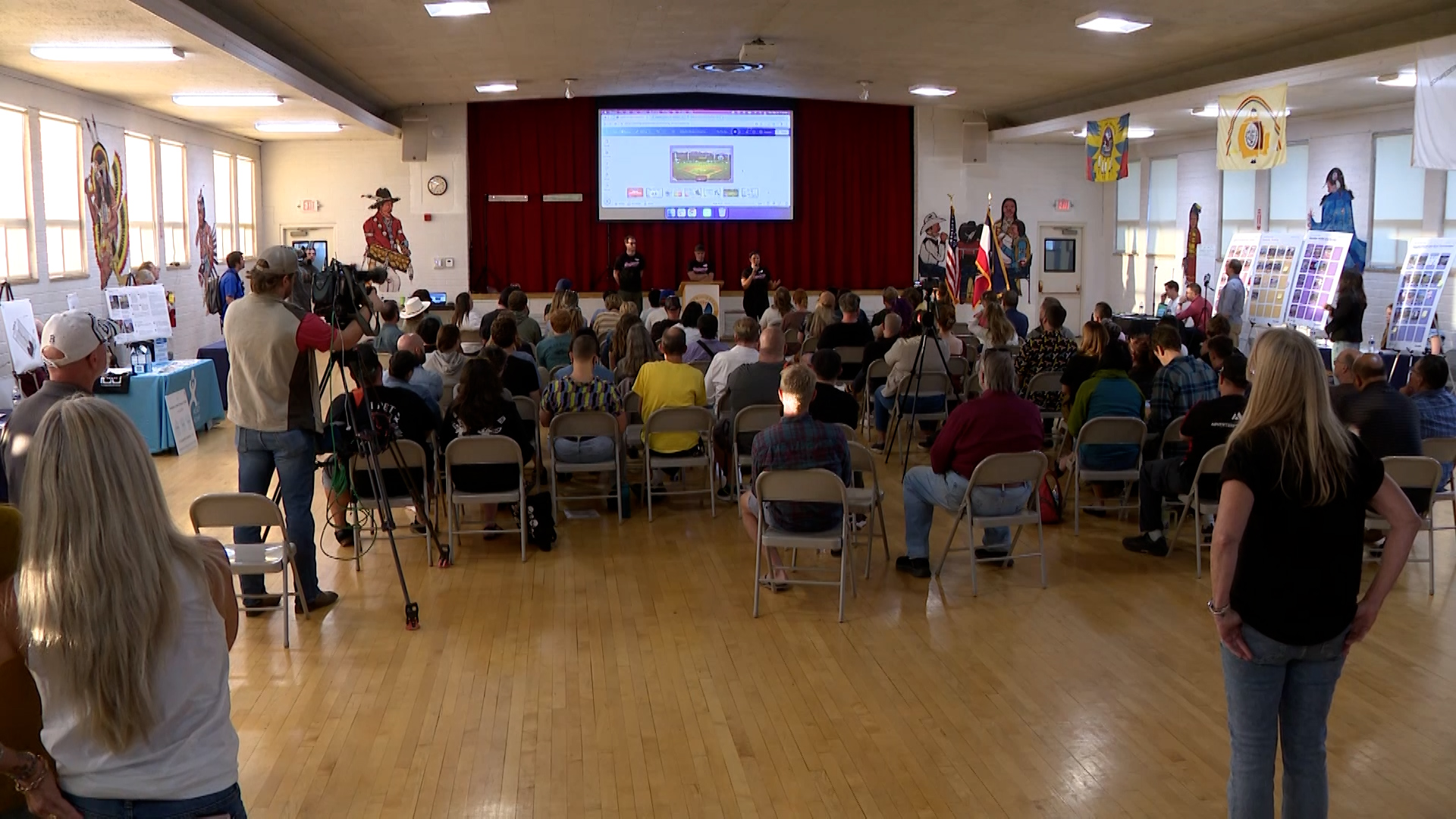 People inside the Urban Indian Center in the Ballpark neighborhood to ask questions about the futur...