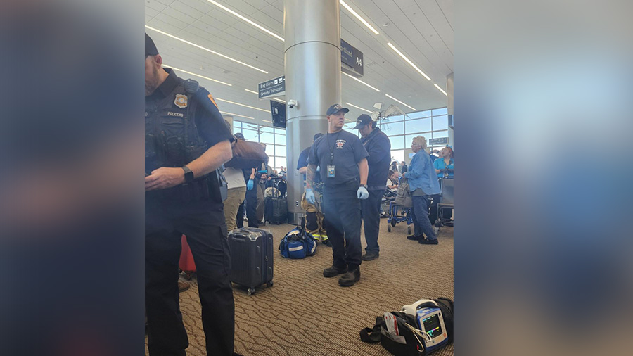 Paramedics outside of the Delta Air Lines gate, helping passengers that were hurt in the air pressu...