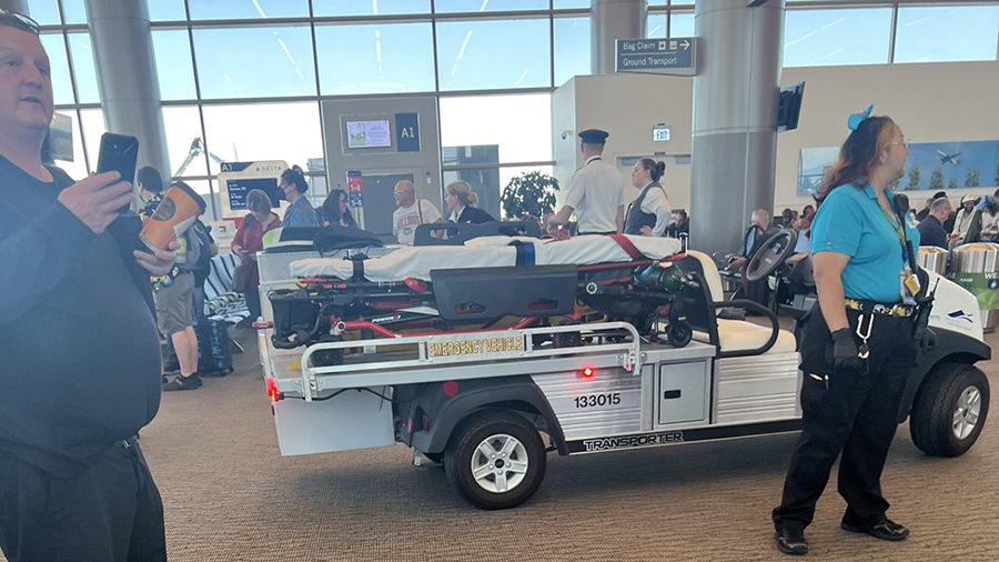 Paramedics outside of the Delta Air Lines gate, helping passengers that were hurt in the air pressurization problem on Sept. 16, 2024.