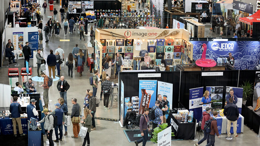 People walk through the Outdoor Retailer Snow Show at the Salt Palace Convention Center in Salt Lak...