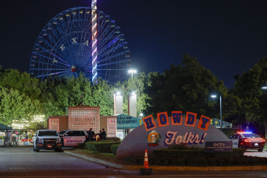 Dallas police block an entrance to the State Fair of Texas after a shooting, Oct. 14, 2023, in Dall...