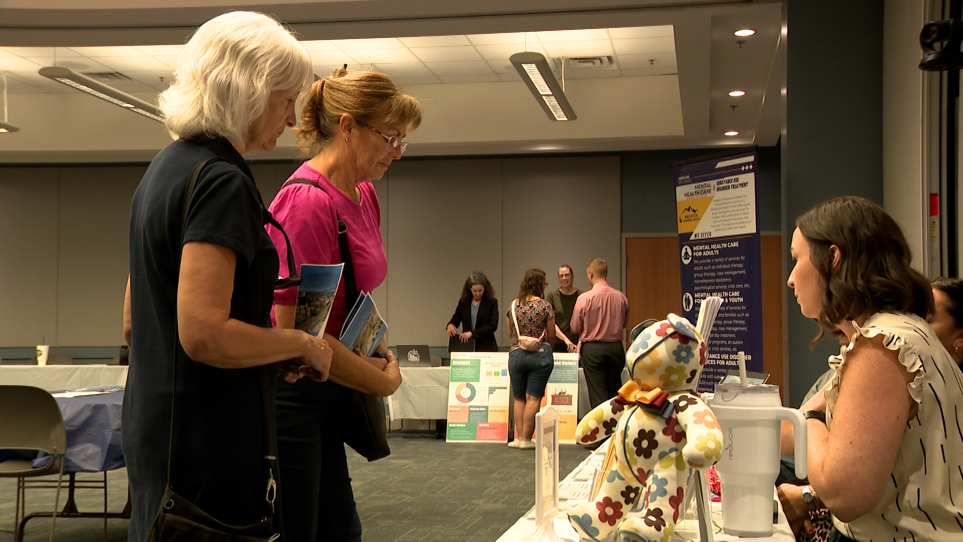 Residents speaking to Utah County staff at the open house. 