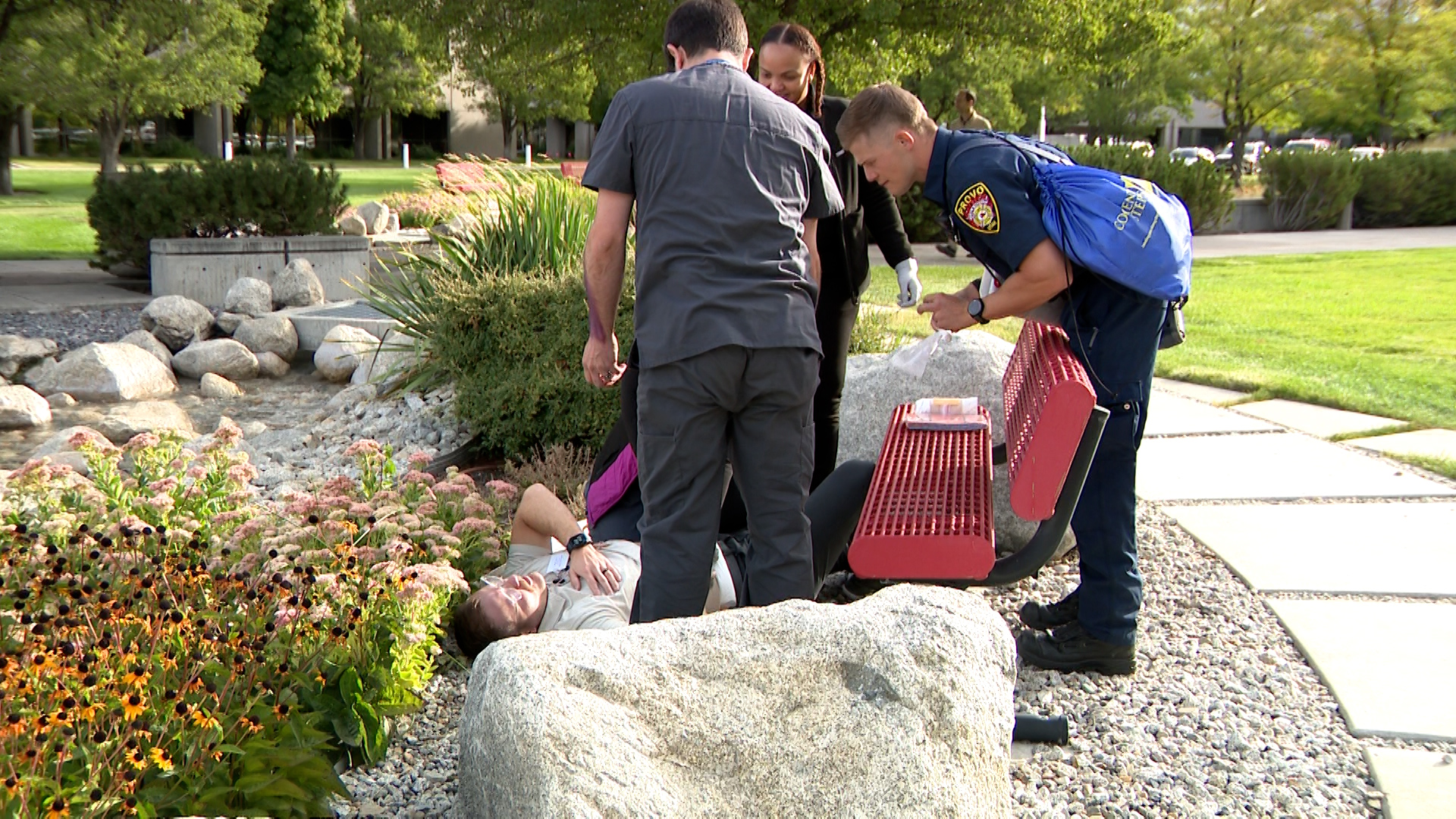 Provo firefighters and Rocky Mountain University students helping a student actor during a staged e...