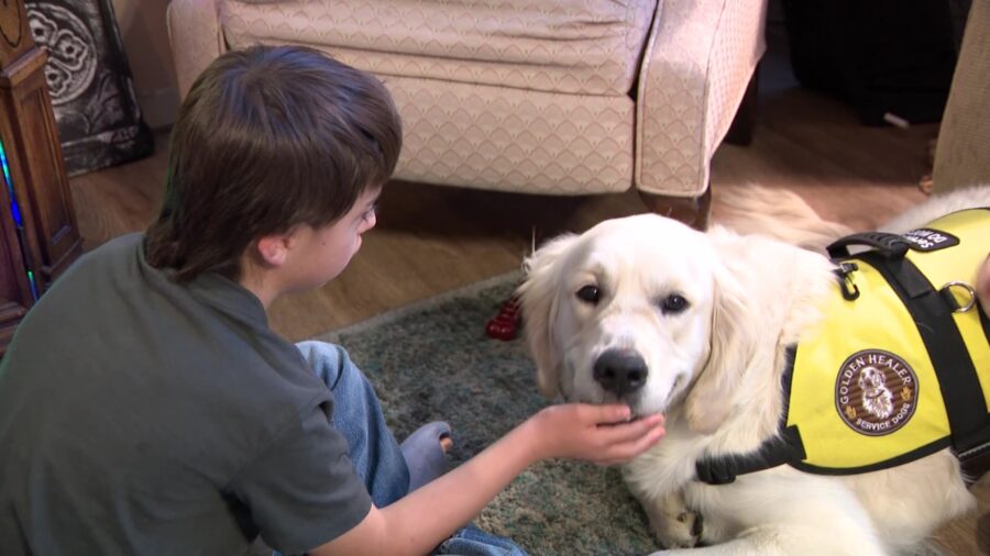 Cryus and his service dog, Magic. (KSL TV)...