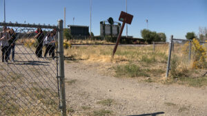 Students walk near train tracks