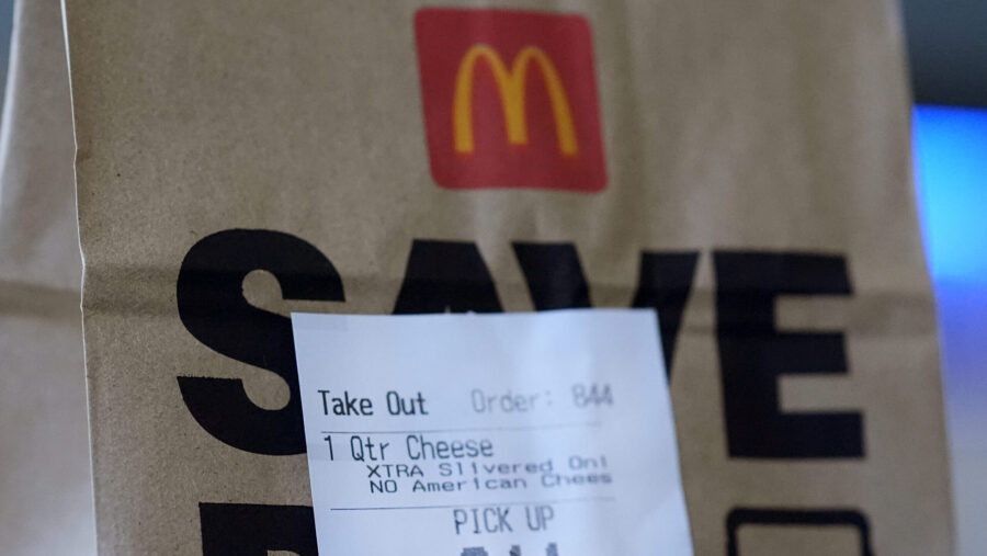 Pictured is a McDonald's bag with an order for a Quarter Pounder sandwich, which has been linked to...