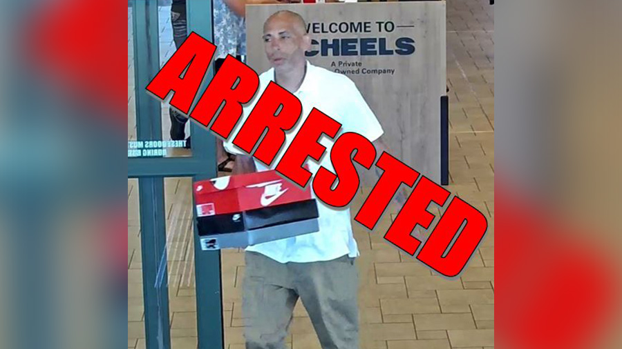 Photo shows a man walking out of Scheels with two shoe boxes. Thomas was accused of several retail ...