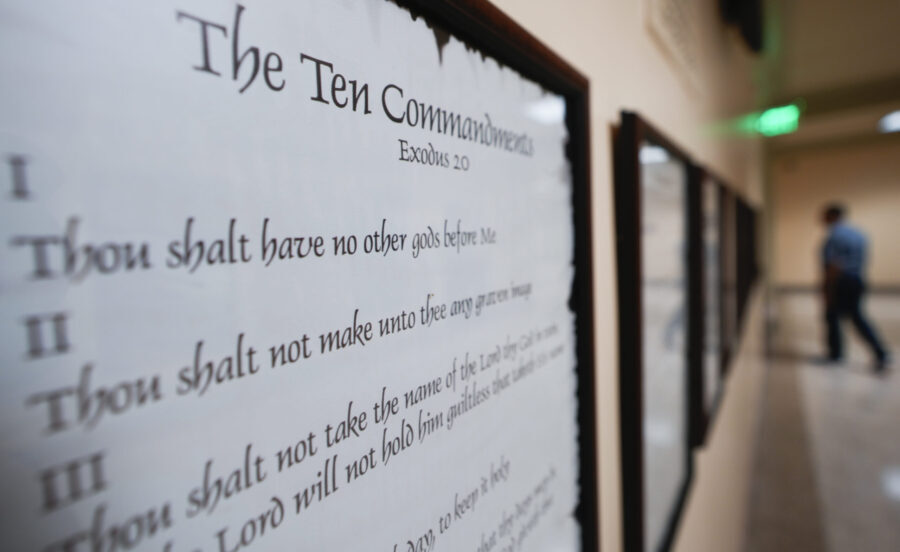 FILE - A copy of the Ten Commandments is posted along with other historical documents in a hallway ...