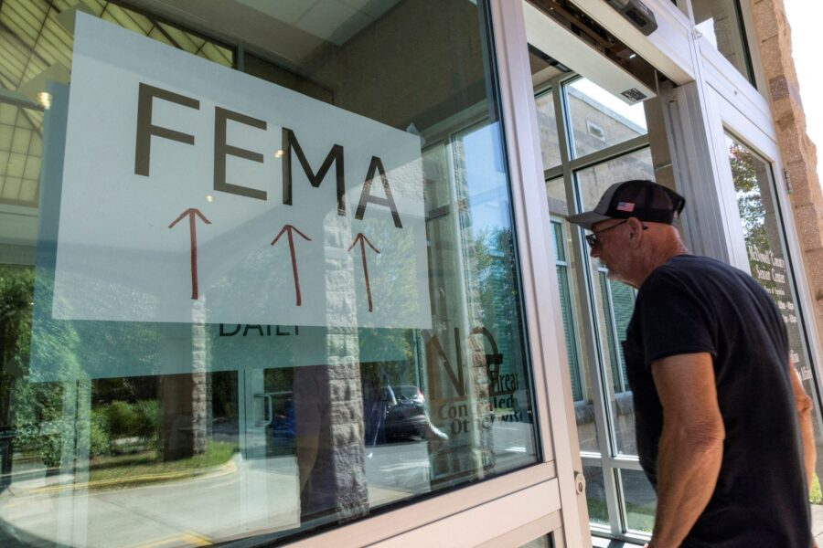 A resident enters a FEMA improvised station to attend claims by local residents affected by floods ...