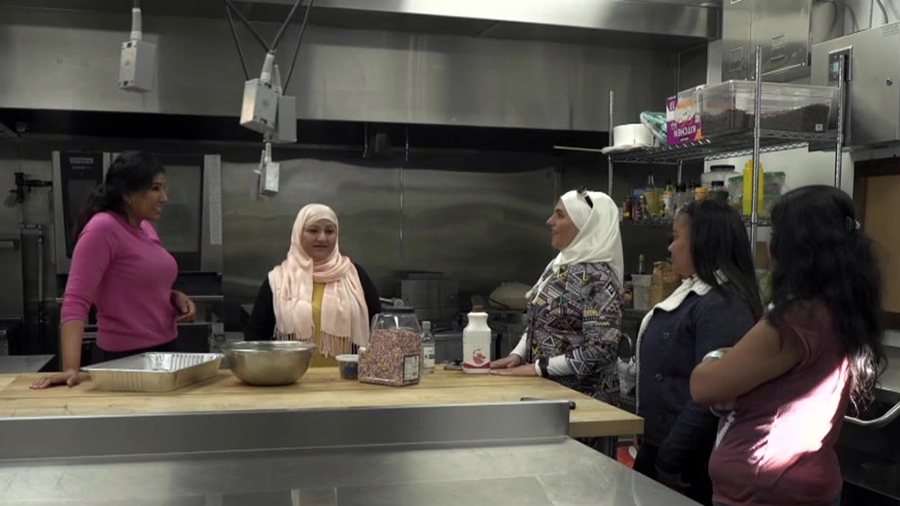 five women in a kitchen...